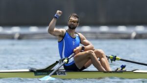 Stefanos Ntouskos of Greece reacts after competing in the men's rowing single sculls semifinal at the 2020 Summer Olympics, Thursday, July 29, 2021, in Tokyo, Japan. (AP Photo/Lee Jin-man)